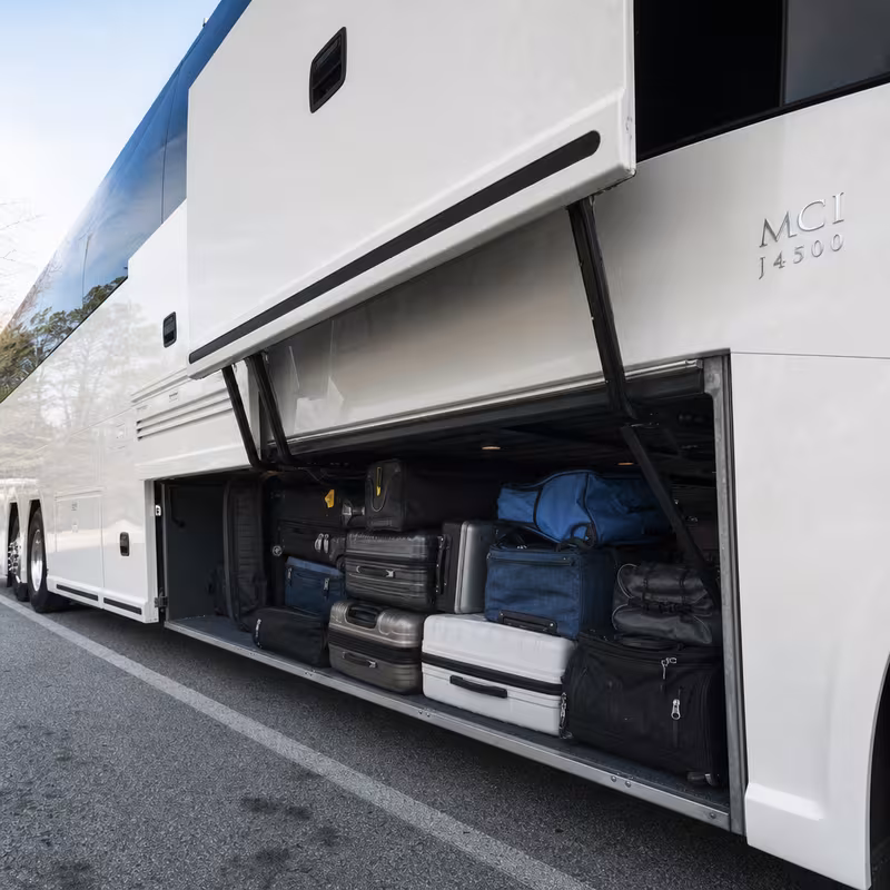 Party bus interior with wraparound leather seating and LED lighting in Garland