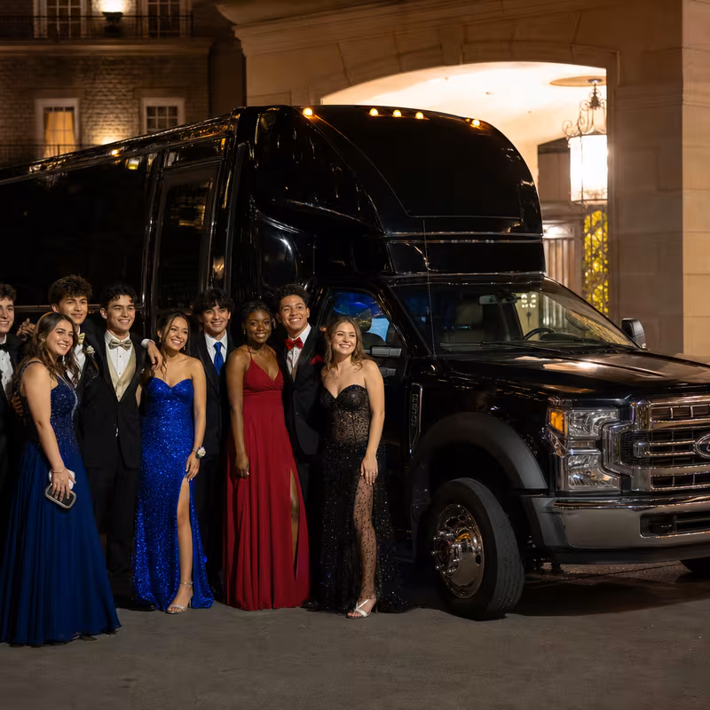 Party bus interior with wraparound leather seating and LED lighting in Garland