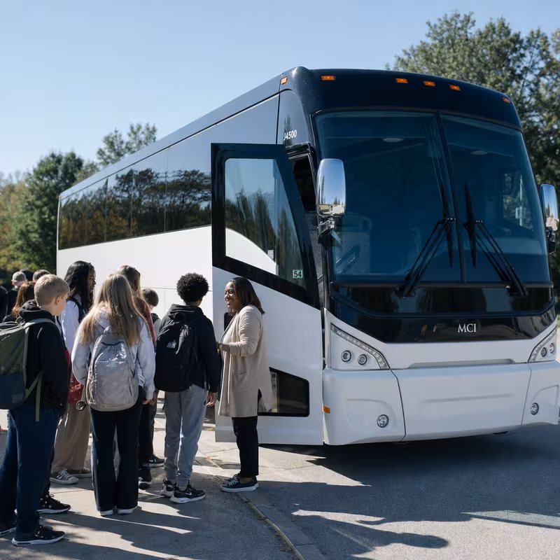 Black Mercedes Sprinter van staged for an Garland School Transportation group