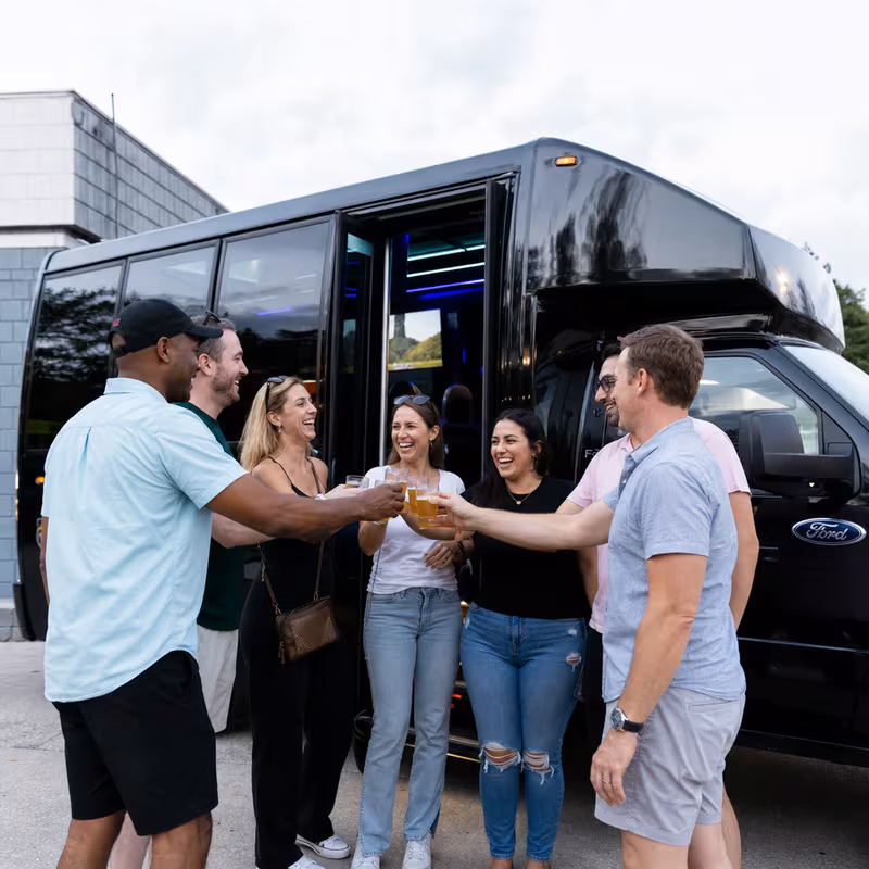 Passengers loading luggage while boarding an Garland group shuttle